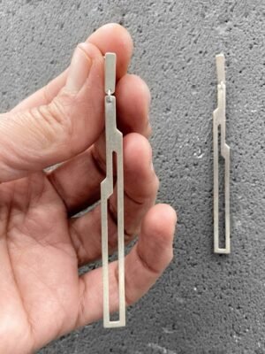 Asymmetrical sterling silver dangle earrings in architectural design