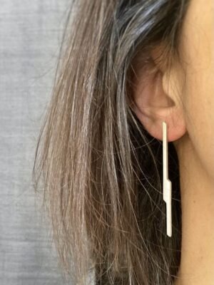 Second image of product: Long mismatched stud earrings in sterling silver