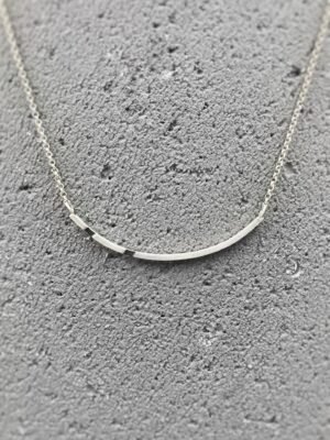 Asymmetrical sterling silver necklace with oxidized details in minimalist design