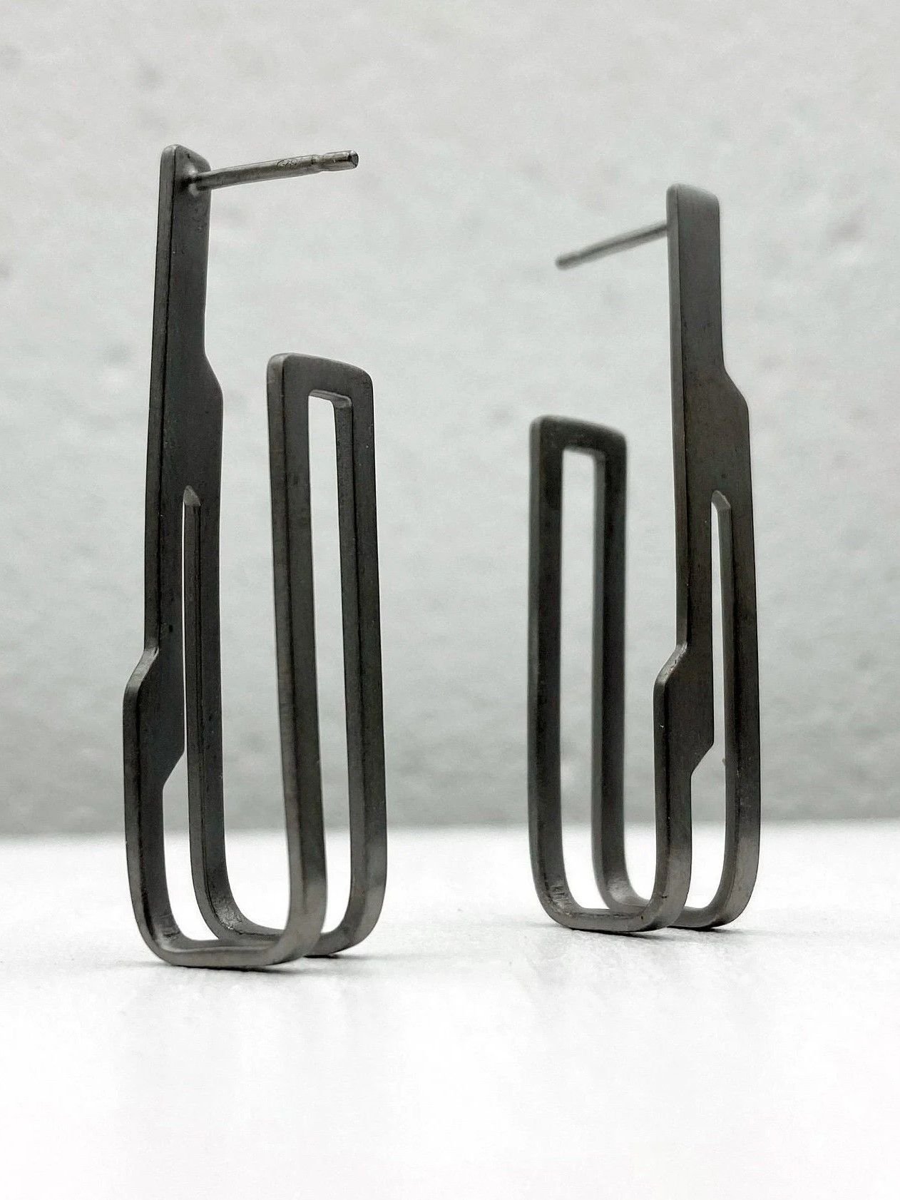 Sterling silver stud earrings plated with black rhodium in architectural design