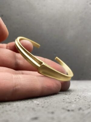 Asymmetrical modern cuff bracelet in gold plated sterling silver