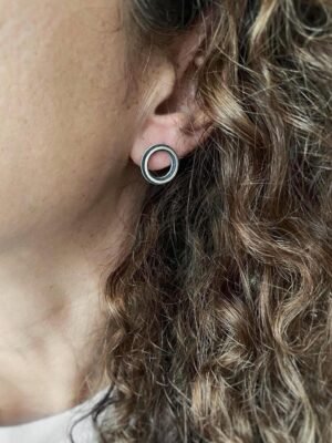 Second image of product: Small modern round stud earrings in oxidized sterling silver
