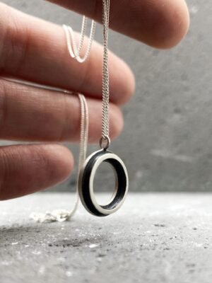 Second image of product: Small modern round pendant necklace in oxidized sterling silver