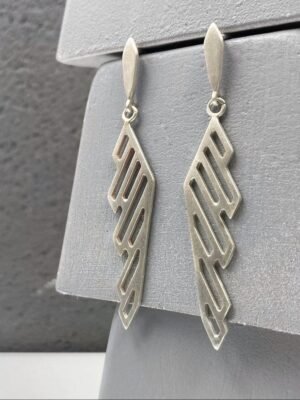Modern sterling silver hoop earrings with oxidized details