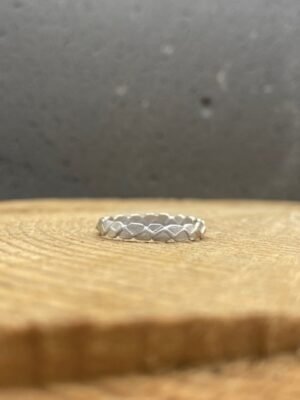 Forms textured ring in sterling silver